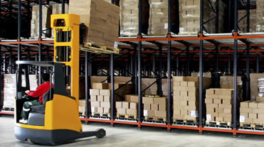 Forklift at work in warehouse